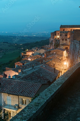 Gorgeous view of the lush agricultural fields and buildings of Montepulciano, Italy at night