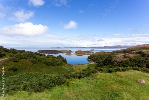 Scenic coastal landscape surrounded by greenery in Drumbeg, Scotland