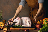 Woman preparing a turkey for family Thanksgiving dinner