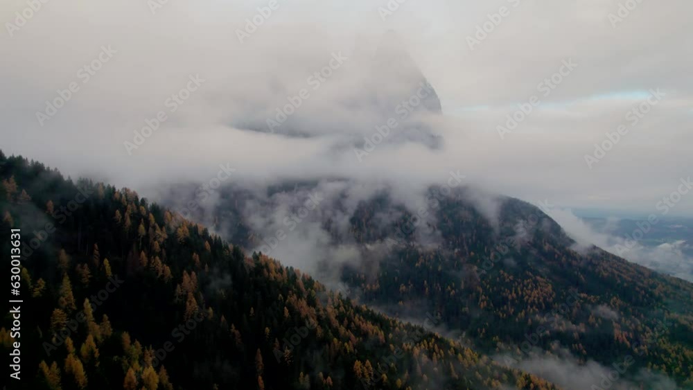 Aerial video of rocky mountains covered with trees in winter Aerial video of rocky mountains covered with trees in winter