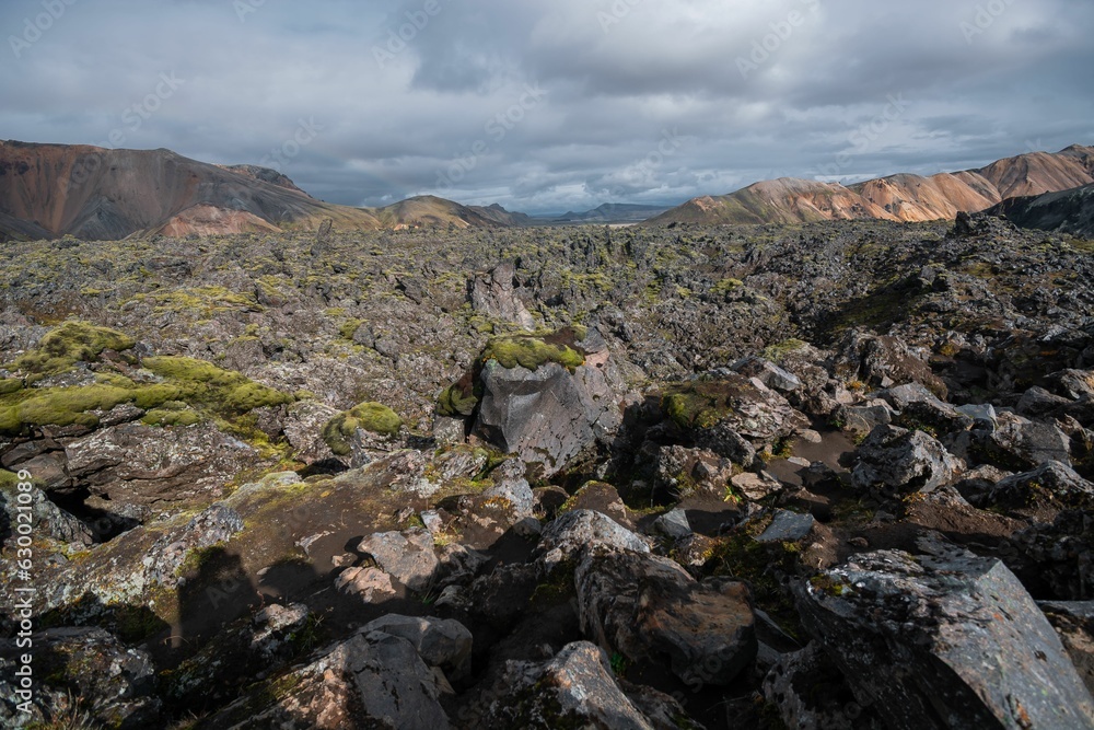 Mountain range with mossy rocks in the foreground. Landmannalaugar, Iceland. Mountain range with mossy rocks in the foreground. Landmannalaugar, Iceland.