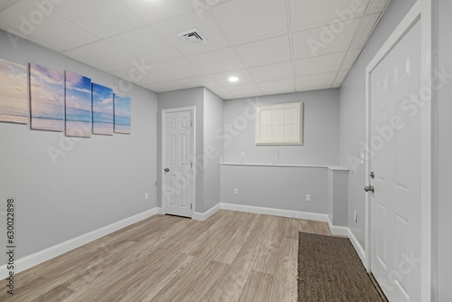 Wallpaper Mural Empty room with a few colorful paintings adorning the walls. Torontodigital.ca