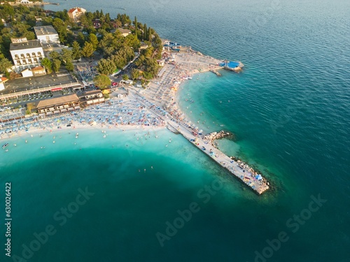 Aerial view o of people enjoying a sunny day at the beach in Selce, Croatia