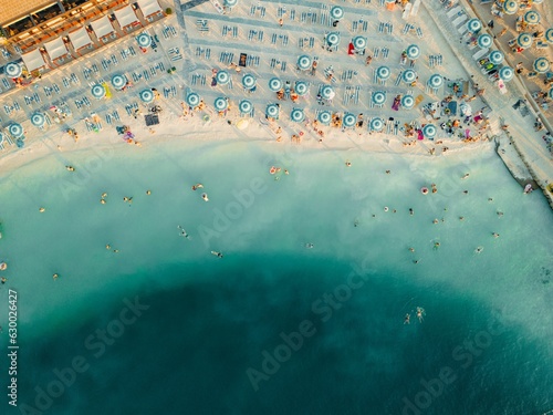 Fototapeta Naklejka Na Ścianę i Meble -  Aerial view o of people enjoying a sunny day at the beach in Selce, Croatia