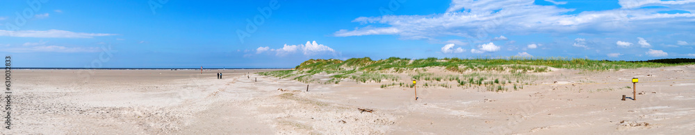 Panorama of the protected dunes of Sankt Peter Ording on a sunny day. North Sea, Germany Panorama of the protected dunes of Sankt Peter Ording on a sunny day. North Sea, Germany