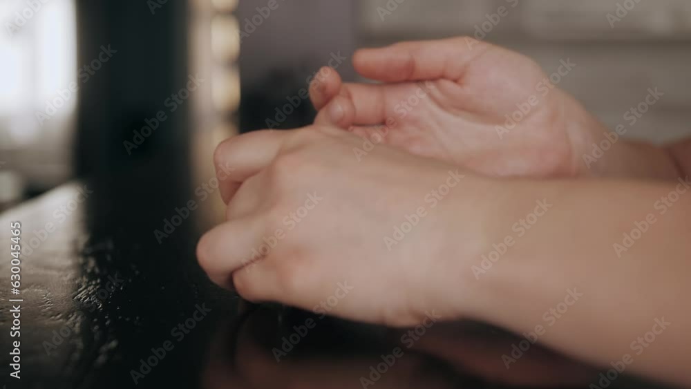Close up shot of young woman taking off wedding ring, divorce concept, female hands holding engagement ring, cheated girl break up with boyfriend or husband