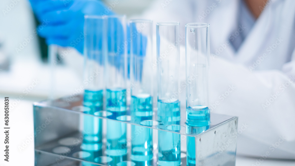 Glassware, beaker or test tube with blue substance or liquid. Concept of laboratory background. Scientific analysis tools background. Chemistry and experiment glassware. Glassware, beaker or test tube with blue substance or liquid. Concept of laboratory background. Scientific analysis tools background. Chemistry and experiment glassware.