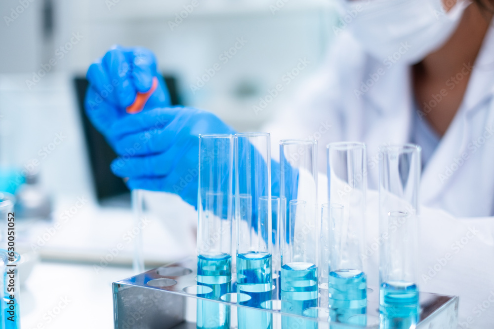 Glassware, beaker or test tube with blue substance or liquid. Concept of laboratory background. Scientific analysis tools background. Chemistry and experiment glassware. Glassware, beaker or test tube with blue substance or liquid. Concept of laboratory background. Scientific analysis tools background. Chemistry and experiment glassware.