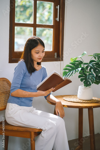 Women reading book and relaxing at home and comfort in front of opened book