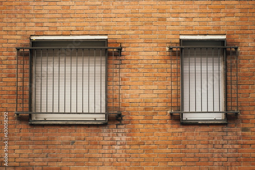 Copy space outdoors shot of two closed with blind windows on old brick wall. photo