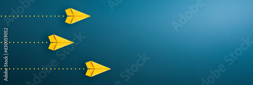Yellow paper plane on blue background, Business competition concept. copy space