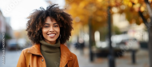 Portrait of a Beautiful Black Woman in front of a Autumn City Background in the Fall photo
