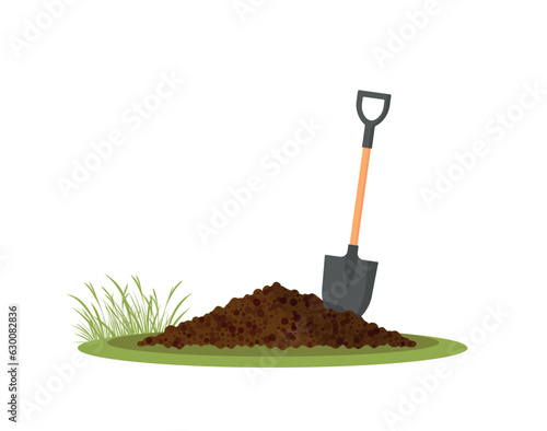Shovel in the ground. Gardening tool on checked background. Isolated shovel in heap of soil
