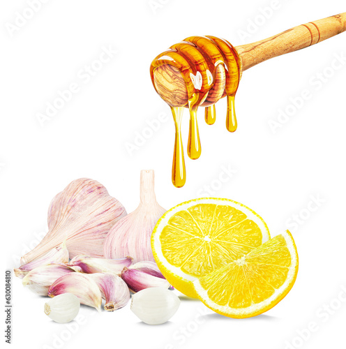 dripping honey, garlic and lemon isolated on white background