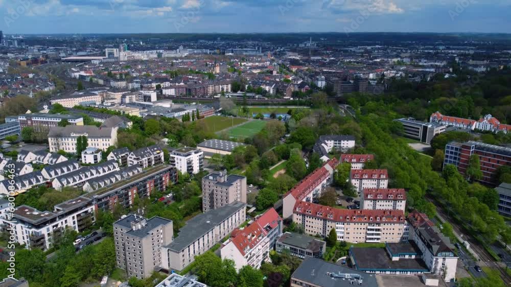 Drone aerial shot of city streets in Dusseldorf Germany with residential buildings, traffic, cars, street trams, people, commercial space, houses in the early morning at sunrise. Urban flight Drone aerial shot of city streets in Dusseldorf Germany with residential buildings, traffic, cars, street trams, people, commercial space, houses in the early morning at sunrise. Urban flight