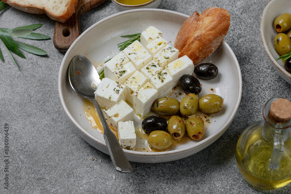 Feta cheese, olives and ciabatta bread and olive oil , top view Feta cheese, olives and ciabatta bread and olive oil , top view