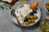 Feta cheese, olives  and ciabatta bread and olive oil , top view