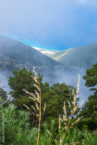 White dense fog high in the mountains on the Llogara pass. View from the highlands. clouds over. photo