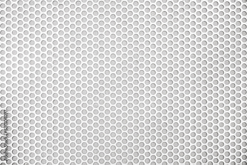 Empty white (light gray) perforated metal grid with circular holes for abstract  horizontal seamless, rounded mesh plate background, steel texture, space patterns for work, modern wallpaper,close up