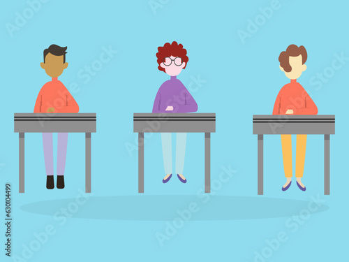 Three children sitting at the desks, participating in school, back to school