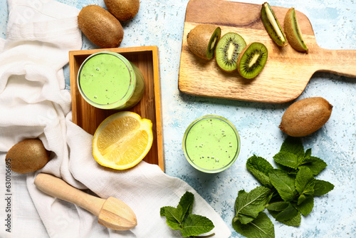 Wallpaper Mural Glasses of fresh kiwi smoothie with mint and lemon on light blue background Torontodigital.ca
