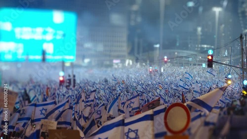 Thousands of people wave Israeli flags during demonstrations photo