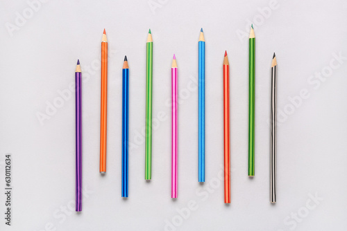 Composition with different pencils on light background