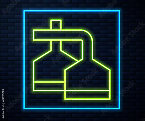 Glowing neon line Traditional brewing vessels in brewery icon isolated on brick wall background. Beer brewing process. Distillery plant, brewery. Vector