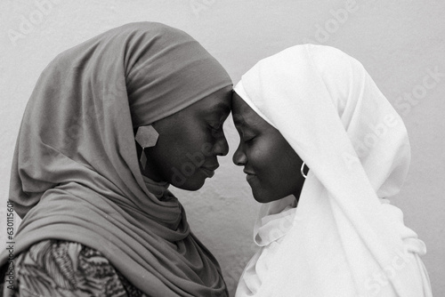 African mom and daughter traveling photo