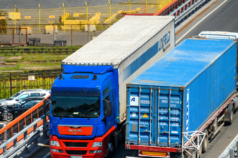 a truck transports a container, a view of a commercial industrial ...