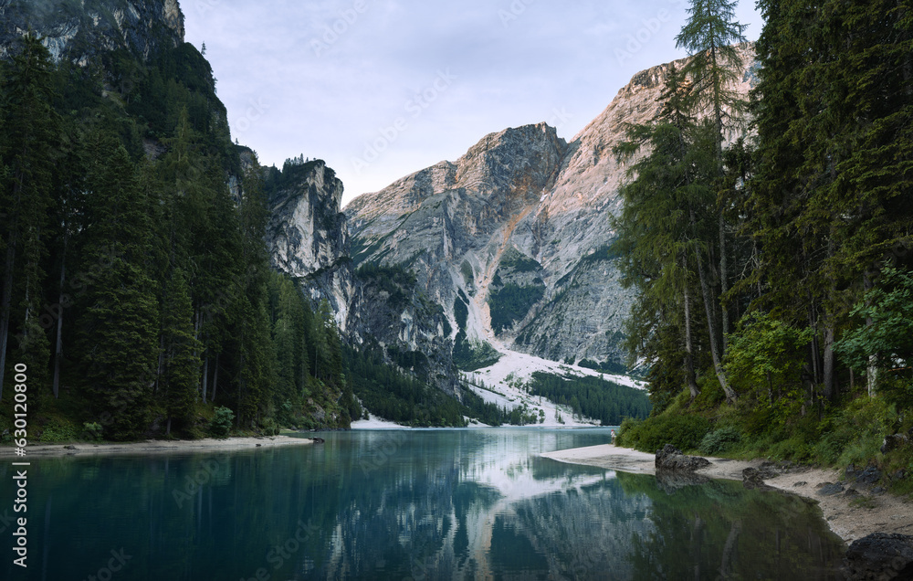 Lake Braies (also known as Pragser Wildsee or Lago di Braies) in Dolomites Mountains, Sudtirol, Italy. Romantic place with typical wooden boats on the alpine lake. Hiking travel and adventure. Lake Braies (also known as Pragser Wildsee or Lago di Braies) in Dolomites Mountains, Sudtirol, Italy. Romantic place with typical wooden boats on the alpine lake. Hiking travel and adventure.