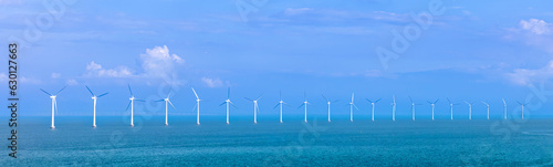 Photography Renewable energy wind power plant and wind turbines along Denmark sea shoreline near Copenhagen