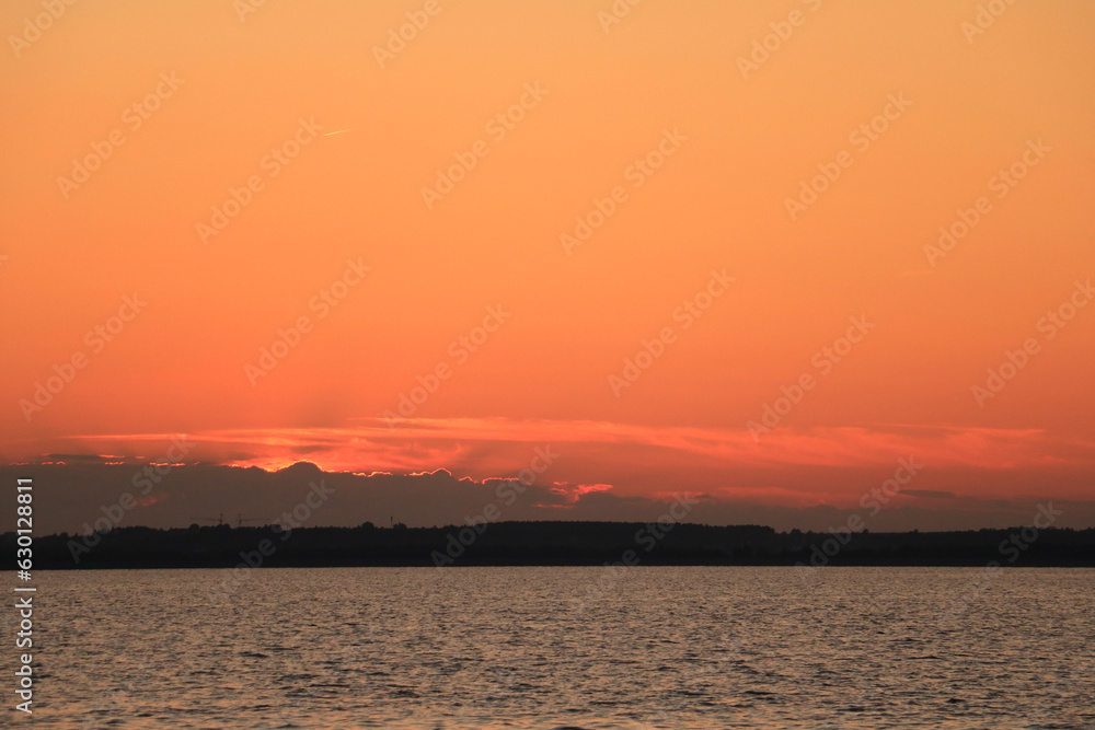 Naklejka premium sunset over the river