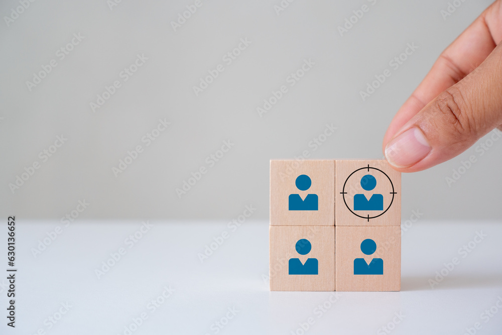 Target customer, buyer persona, marketing segmentation, Customer relationship management (CRM),  job recruitment concept. Wooden cube blocks focused on target customer symbols.