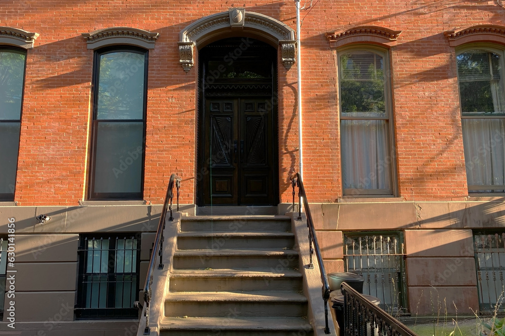 Hoboken, NJ, USA, brownstone entrance, facade of the building, staircase leading to the door