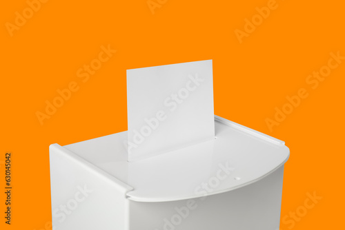 Ballot box with vote on orange background. Election time