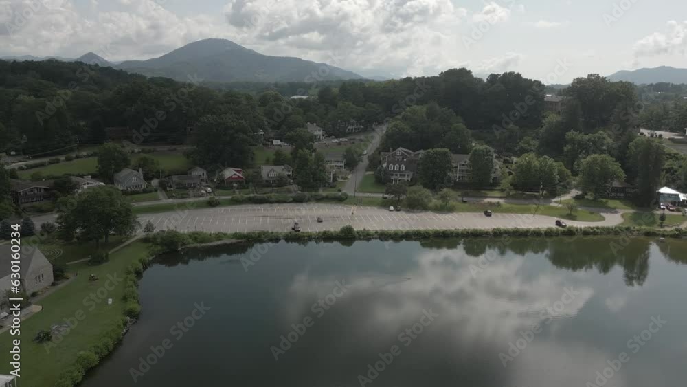 Cloud sky reflects in Lake Junaluska in aerial retreat past auditorium Cloud sky reflects in Lake Junaluska in aerial retreat past auditorium