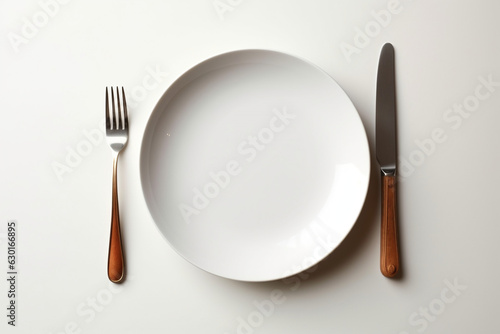plate with fork and knife on white background