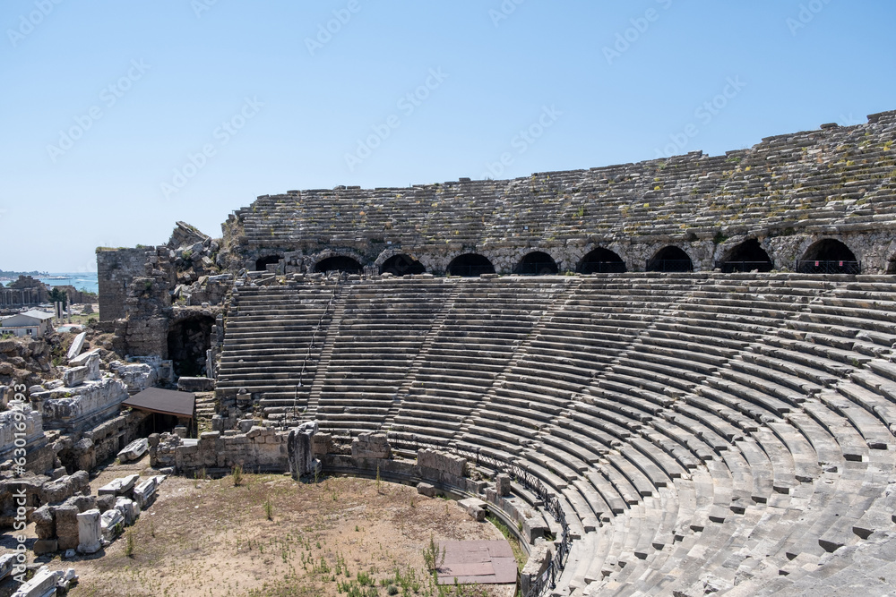 Side Ancient theatre. Turkey. Antalya. Ruins of the ancient city of Side. The largest amphitheater in Turkey. Main street of the ancient city. Mediterranean Sea.