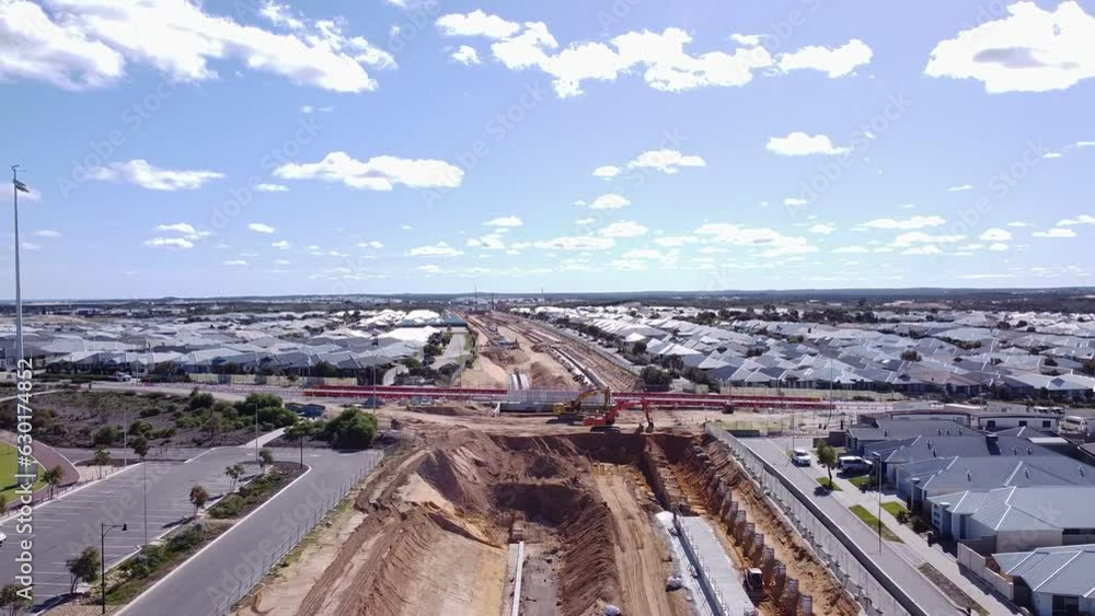 Aerial Pull Back View Of Road Over Rail Construction Works, Yanchep Rail Extension Near Butler Aerial Pull Back View Of Road Over Rail Construction Works, Yanchep Rail Extension Near Butler