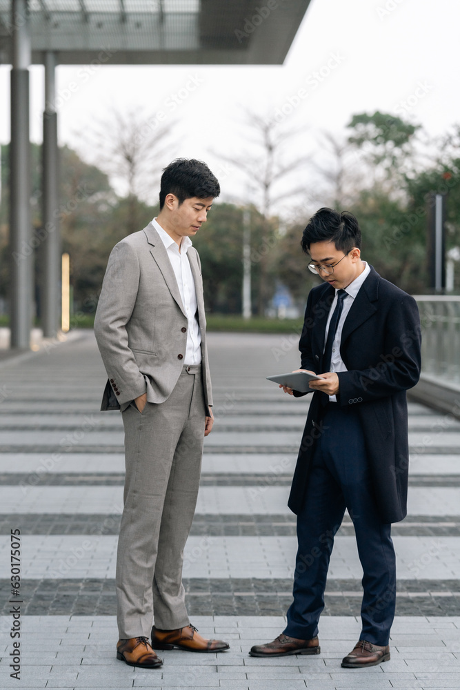 business people talking outside the office building. business people talking outside the office building.