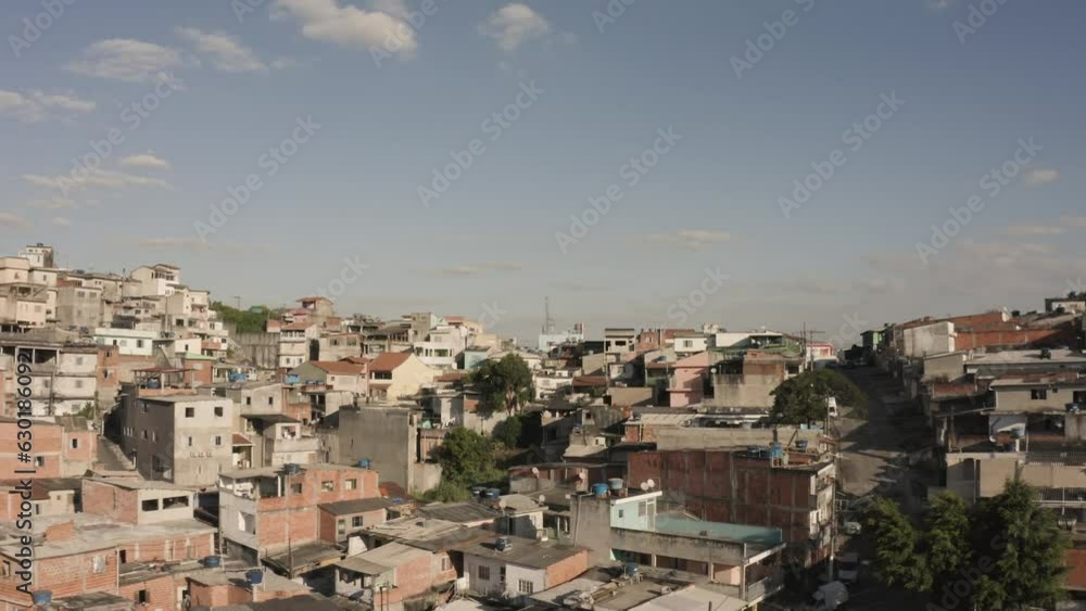 Slow forward drone flyover destroyed old buildings in Favela of Sao Paulo during sunny day with blue sky Slow forward drone flyover destroyed old buildings in Favela of Sao Paulo during sunny day with blue sky