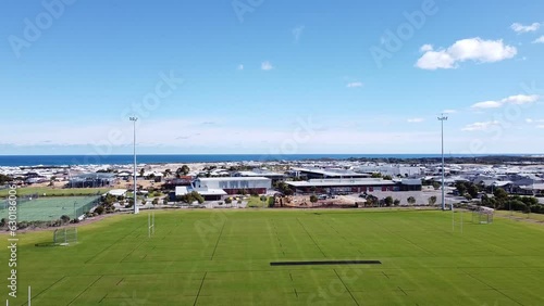 Aerial View Over Halesworth Park Rugby Pitches With Alkimos College And Ocean In Background photo