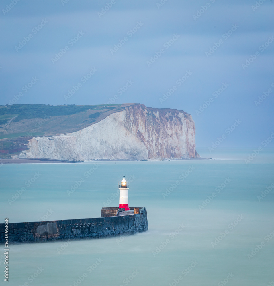 View of Newhaven lighthouse and seaford head from castle hill cliffs on the east Sussex coast south east England UK