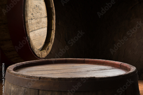 Beer barrel with beer glasses on table on wooden background