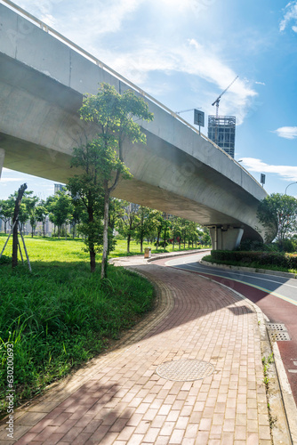 Concrete structure and asphalt road space under the overpass in the city