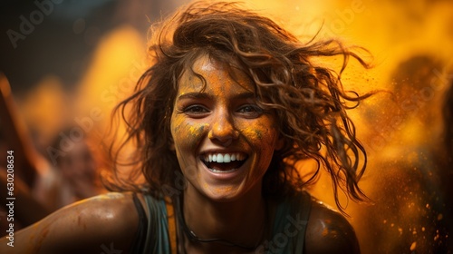 Woman enjoying the Holi celebration of colours in India -.