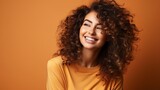 a smiling, gorgeous girl of colour.dark, curly hair