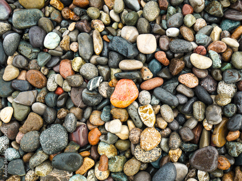 Beautiful wet colorful pebbles background.