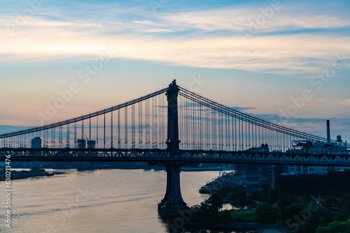 new york city architecture. brooklyn bridge to manhattan. urban architecture landmark of brooklyn bridge. architecture of metropolis city. brooklyn bridge. Popular tourist attraction at sunset